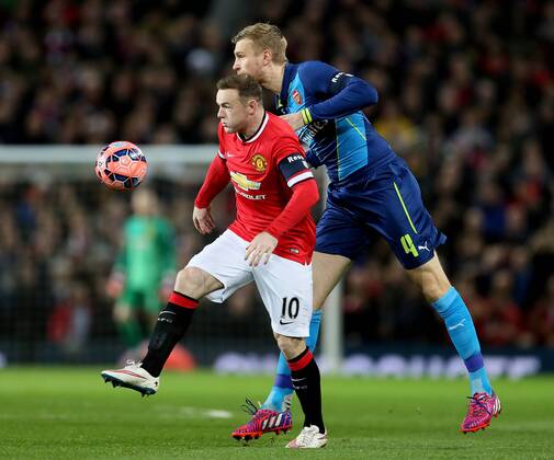 Wayne Rooney of Manchester United ManU tussles with Per Mertesacker of Arsenal - FA Cup Sixth Round - Manchester Utd vs Arsenal - Old Trafford Stadium - Manchester - England - 9th March 2015 - Picture Simon Bellis Sportimage EDITORIAL USE ONLY. No use with unauthorised audio, video, data, fixture lists, club league logos or live services. Online in-match use limited to 120 images, no video emulation. No use in betting, games or single club league player publications.