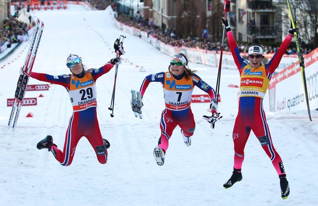 NORDIC SKIING - FIS WC Drammen DRAMMEN,NORWAY,11.MAR.15 - NORDIC SKIING, CROSS COUNTRY SKIING - FIS World Cup, sprint, ladies. Image shows the rejoicing of Heidi Weng, Maiken Caspersen Falla and Marit Bjoergen (NOR).