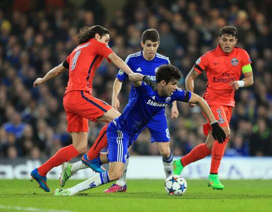 Chelsea s Diego Costa gets caught by PSG s Edinson Cavani Champions League Round of 16 Second leg- Chelsea vs Paris Saint-Germain - Stamford Bridge - England - 11th March 2015 - EDITORIAL USE ONLY. No use with unauthorised audio, video, data, fixture lists, club league logos or live services. Online in-match use limited to 120 images, no video emulation. No use in betting, games or single club league player publications.