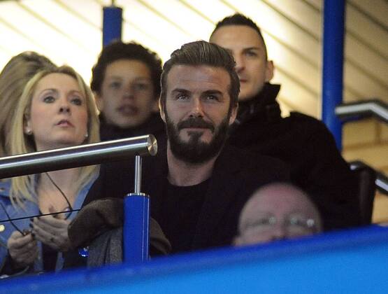 Football - 2014 2015 Champions League - Round of 16, Second Leg: Chelsea 1 vs. Paris Saint-Germain 1 David Beckham watches the match at Stamford Bridge. COLORSPORT ANDREW COWIE 