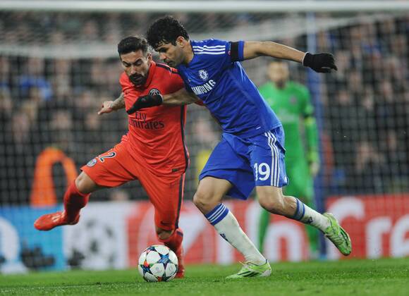 Football - 2014 2015 Champions League - Round of 16, Second Leg: Chelsea 1 vs. Paris Saint-Germain 1 Diego Costa of Chelsea and Ezequiel Lavezzi of PSG at Stamford Bridge. COLORSPORT ANDREW COWIE 