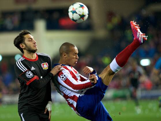 Bayer 04 Leverkusen Midfielder, Hakan Calhanoglu, number 10 . Atletico de Madrid Defender, Joao Miranda de Souza Filho, number 23. Round 1 8 of the CHAMPIONS league, soccer match between Atletico de Madrid - Bayer 04 Leverkusen at the Vicente Calderon estadium, Madrid - Spain by March 17, 2015. 