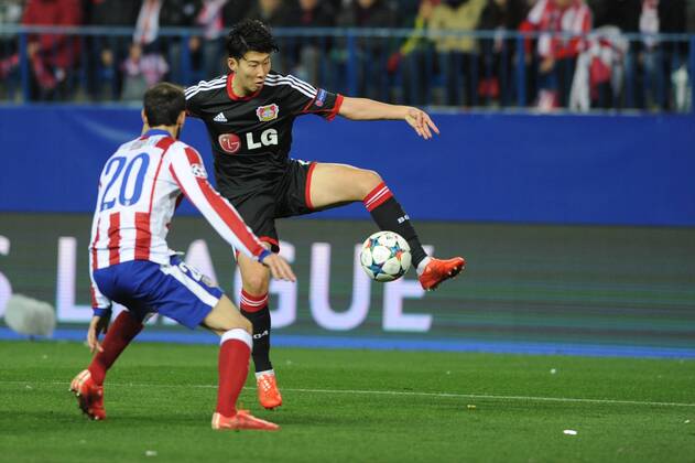 Bayer 04 Leverkusen Forward, Son Heung-Min - Son Heung-Min, number 7 . Atletico de Madrid Defender, Juan Francisco Torres Belen - JUANFRAN, number 20. Round ROUND 16 of the CHAMPIONS league soccer match between Atletico de Madrid - Bayer 04 Leverkusen at the Vicente Calderon estadium Madrid - Spain by March 17 2015. 