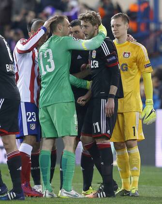 Atletico de Madrid s Joao Miranda (l) and Jan Oblak (2l) and Bayer 04 Leverkusen s Stefan Kiessling (c-r) and Bernd Leno (r) after Champions League 2014 2015 match.March 17,2015.  (20150301728)