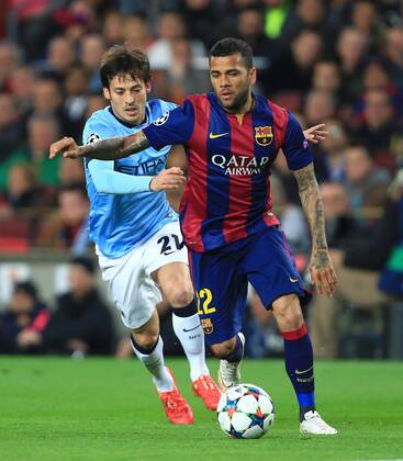 David Silva of Manchester City pressures Dani Alves of Barcelona - Barcelona vs. Manchester City - UEFA Champion s League - Round of 16, second leg - Nou Camp - Barcelona - 18 03 2015 Pic Philip Oldham Sportimage EDITORIAL USE ONLY. No use with unauthorised audio, video, data, fixture lists, club league logos or live services. Online in-match use limited to 120 images, no video emulation. No use in betting, games or single club league player publications.
