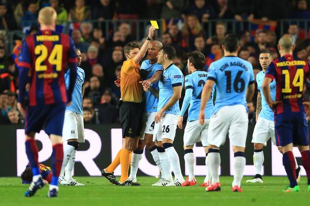 David Silva of Manchester City is shown a yellow card for his tackle on Lionel Messi of Barcelona - Barcelona vs. Manchester City - UEFA Champion s League - Round of 16, second leg - Nou Camp - Barcelona - 18 03 2015 Pic Philip Oldham Sportimage EDITORIAL USE ONLY. No use with unauthorised audio, video, data, fixture lists, club league logos or live services. Online in-match use limited to 120 images, no video emulation. No use in betting, games or single club league player publications.