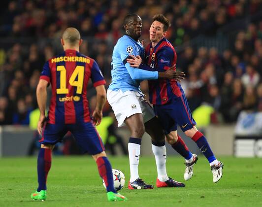 Yaya Toure of Manchester City collides with Lionel Messi of Barcelona - Barcelona vs. Manchester City - UEFA Champion s League - Round of 16, second leg - Nou Camp - Barcelona - 18 03 2015 Pic Philip Oldham Sportimage EDITORIAL USE ONLY. No use with unauthorised audio, video, data, fixture lists, club league logos or live services. Online in-match use limited to 120 images, no video emulation. No use in betting, games or single club league player publications.