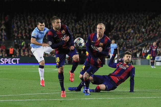 Sergio Kun Agüero of Manchester City strikes at goal but is blocked by the Barcelona defence - Barcelona vs. Manchester City - UEFA Champion s League - Round of 16, second leg - Nou Camp - Barcelona - 18 03 2015 Pic Philip Oldham Sportimage EDITORIAL USE ONLY. No use with unauthorised audio, video, data, fixture lists, club league logos or live services. Online in-match use limited to 120 images, no video emulation. No use in betting, games or single club league player publications.