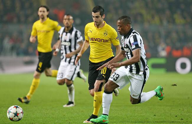 18.03.2015, Fussball Championsleague 2014 2015, Achtelfinale , Borussia Dortmund - Juventus Turin, im Signal-Iduna-Park-Stadion Dortmund. v.l. Henrikh Mkhitaryan (Dortmund) gegen Patrice Evra (Juventus Turin) 