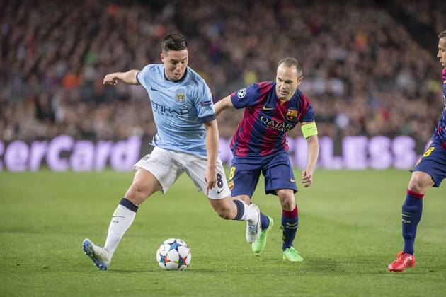 BARCELONA, SPAIN - MARCH 18: Samir Nasri of Manchester City and Andres Iniesta of FC Barcelona Barca during the UEFA Champions League round of 16 match between FC Barcelona and Manchester City at Camp Nou Stadium on March 18, 2015 in Barcelona, Spain. 