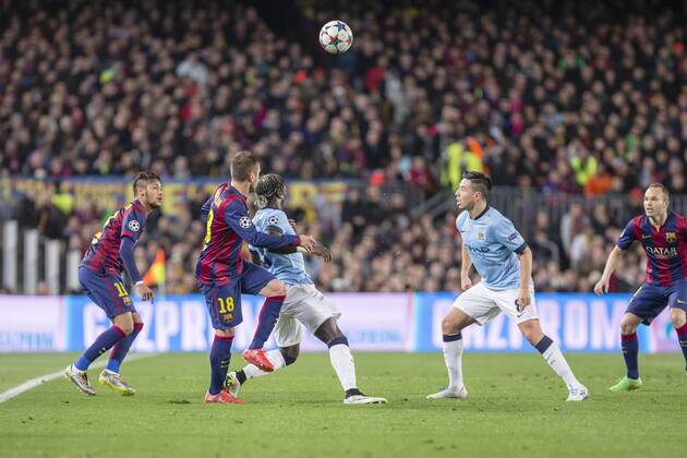 BARCELONA, SPAIN - MARCH 18: Bacary Sagna of Manchester City and Samir Nasri of Manchester City during the UEFA Champions League round of 16 match between FC Barcelona Barca and Manchester City at Camp Nou Stadium on March 18, 2015 in Barcelona, Spain. 