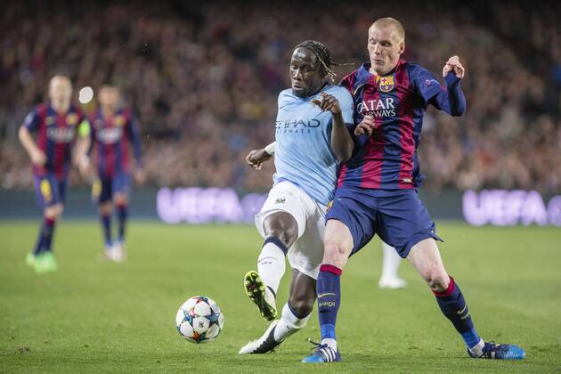 BARCELONA, SPAIN - MARCH 18: Jeremy Mathieu of FC Barcelona Barca and Bacary Sagna of Manchester City during the UEFA Champions League round of 16 match between FC Barcelona and Manchester City at Camp Nou Stadium on March 18, 2015 in Barcelona, Spain. 