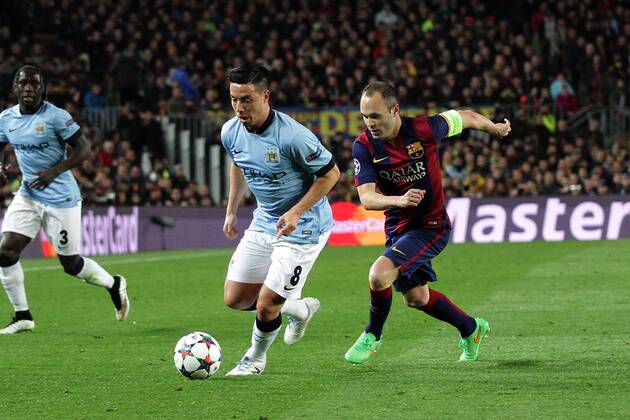 18.03.2015. Nou Camp, Barcelona, Spain. iChampions League Football. FC Barcelona (Barca) versus Manchester City. Samir Nasri challenged by Andres Iniesta xAngelxBoludax  ActionPlus11605992