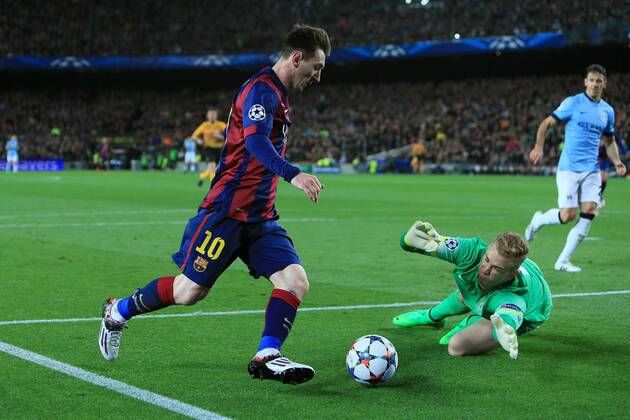 Joe Hart of Manchester City dives at the feet of Lionel Messi of Barcelona - Barcelona vs. Manchester City - UEFA Champion s League - Round of 16, second leg - Nou Camp - Barcelona - 18 03 2015 Pic Philip Oldham Sportimage EDITORIAL USE ONLY. No use with unauthorised audio, video, data, fixture lists, club league logos or live services. Online in-match use limited to 120 images, no video emulation. No use in betting, games or single club league player publications.