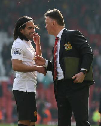 Louis van Gaal manager of Manchester United ManU talks to a smiling Radamel Falcao of Manchester United - Barclays Premier League - Liverpool vs Manchester Utd - Anfield Stadium - Liverpool - England - 22nd March 2015 - Picture Simon Bellis Sportimage EDITORIAL USE ONLY. No use with unauthorised audio, video, data, fixture lists, club league logos or live services. Online in-match use limited to 120 images, no video emulation. No use in betting, games or single club league player publications.