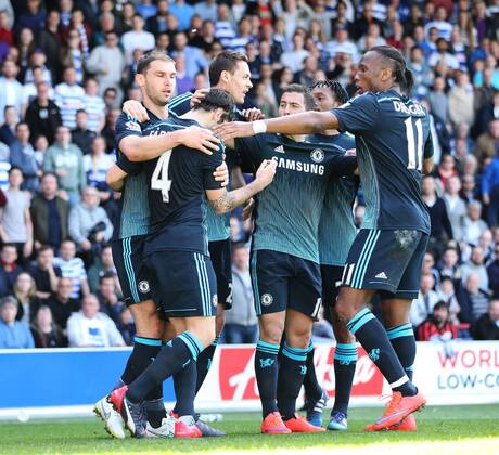 Chelsea s Cesc Fabregas celebrates scoring his sides opening goal as coins get thrown from the crowd Barclays Premier League- Queens Park Rangers vs Chelsea - Loftus Road - England - 12h April 2015 - Picture David Klein Sportimage EDITORIAL USE ONLY. No use with unauthorised audio, video, data, fixture lists, club league logos or live services. Online in-match use limited to 120 images, no video emulation. No use in betting, games or single club league player publications.