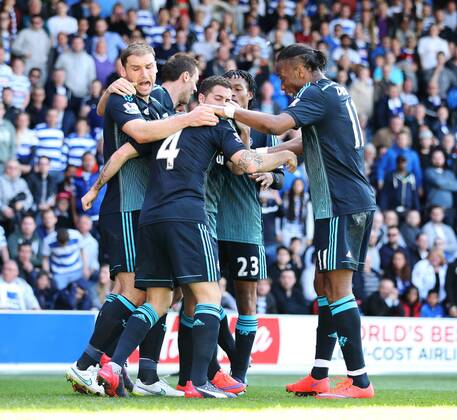 Chelsea s Cesc Fabregas celebrates scoring his sides opening goal as Branislav Ivanovic gets hit by a coin Barclays Premier League- Queens Park Rangers vs Chelsea - Loftus Road - England - 12h April 2015 - Picture David Klein Sportimage EDITORIAL USE ONLY. No use with unauthorised audio, video, data, fixture lists, club league logos or live services. Online in-match use limited to 120 images, no video emulation. No use in betting, games or single club league player publications.