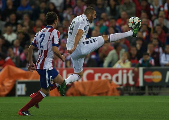 Real Madrid Forward, Karim Benzema, number 9 . Atletico de Madrid Defender, Diego Roberto Godin Leal, number 2. Champions League Atletico Madrid - Real Madrid 