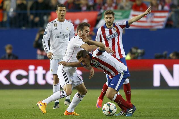Atletico de Madrid s Koke Resurrecccion (c-r) and Guilherme Siqueira (r) and Real Madrid s Cristiano Ronaldo (l) and Daniel Carvajal (c-l) during Champions League 2014 2015 Quarter-finals 1st leg match.April 14,2015.  (2015041410)