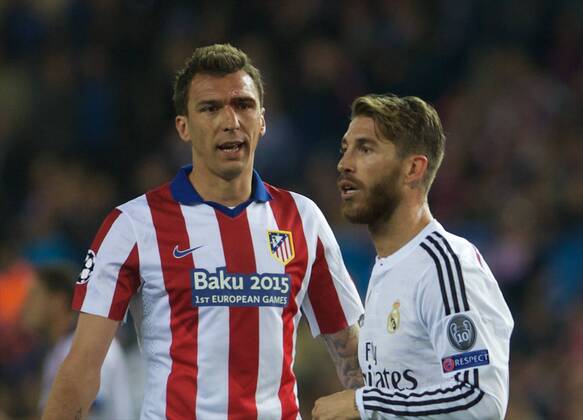 Real Madrid Defender, Sergio Ramos Garcia, number 4 . Atletico de Madrid Forward, Mario Mandzukic, number 9. Round 1 4 of the CHAMPIONS league, soccer match between Atletico de Madrid - Real Madrid at the Vicente Calderon estadium, Madrid - Spain by April 14, 2015. PHOTO: Gregorio Lopez. 