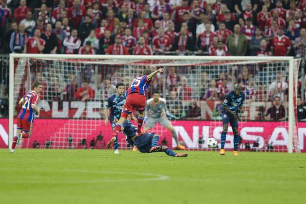 21.04.2015. Munich, Germany. Champions League Football. Bayern Munich versus FC Porto. Bayern Munich& x2019;s Thomas Muller scores his side s fourth goal as the shot deflects off the defender boot to get past the keeper xCraigxMercerx  ActionPlus11614792