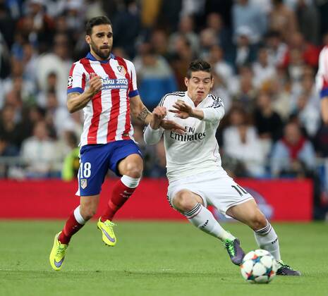 Jesus Gamez of Atletico and James Rodriguez of Real Madrid - Real Madrid vs. Atletico Madrid - UEFA Champions League - Quarter Final Second Leg - Santiago Bernabeu - Madrid - 22 04 2015 Pic Philip Oldham Sportimage EDITORIAL USE ONLY. No use with unauthorised audio, video, data, fixture lists, club league logos or live services. Online in-match use limited to 120 images, no video emulation. No use in betting, games or single club league player publications.