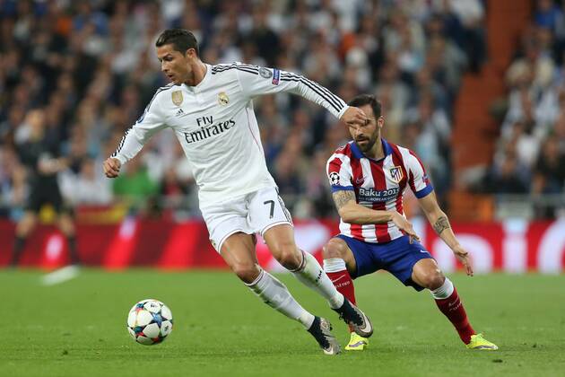 Jesus Gamez of Atletico and Cristiano Ronaldo of Real Madrid - Real Madrid vs. Atletico Madrid - UEFA Champions League - Quarter Final Second Leg - Santiago Bernabeu - Madrid - 22 04 2015 Pic Philip Oldham Sportimage EDITORIAL USE ONLY. No use with unauthorised audio, video, data, fixture lists, club league logos or live services. Online in-match use limited to 120 images, no video emulation. No use in betting, games or single club league player publications.
