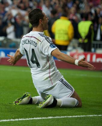 Real Madrid Forward, Javier Chicharito Hernandez, number 14 celebrates after scoring a goal (1,0). Round 1 4 of the CHAMPIONS league, soccer match between Real Madrid - Atletico de Madrid at the Santiago Bernabeu estadium, Madrid - Spain by April 22, 2015. PHOTOxGregorioxLopez. 