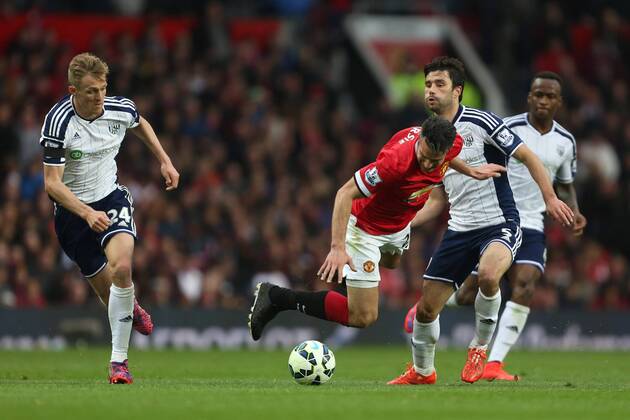 Robin van Persie of Manchester United ManU battles West Brom s Claudio Yacob - Manchester United vs. West Bromwich Albion - Barclay s Premier League - Old Trafford - Manchester - 02 05 2015 Pic Philip Oldham Sportimage EDITORIAL USE ONLY. No use with unauthorised audio, video, data, fixture lists, club league logos or live services. Online in-match use limited to 120 images, no video emulation. No use in betting, games or single club league player publications.