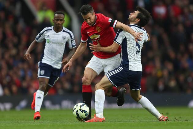 Robin van Persie of Manchester United ManU battles West Brom s Claudio Yacob - Manchester United vs. West Bromwich Albion - Barclay s Premier League - Old Trafford - Manchester - 02 05 2015 Pic Philip Oldham Sportimage EDITORIAL USE ONLY. No use with unauthorised audio, video, data, fixture lists, club league logos or live services. Online in-match use limited to 120 images, no video emulation. No use in betting, games or single club league player publications.