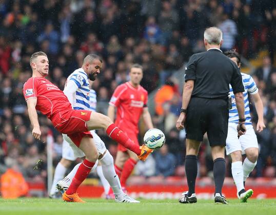 Jordan Henderson of Liverpool tussles with Sandro of QPR - Barclays Premier League - Liverpool vs QPR - Anfield Stadium - Liverpool - England - 2nd May 2015 - Picture Simon Bellis Sportimage EDITORIAL USE ONLY. No use with unauthorised audio, video, data, fixture lists, club league logos or live services. Online in-match use limited to 120 images, no video emulation. No use in betting, games or single club league player publications.