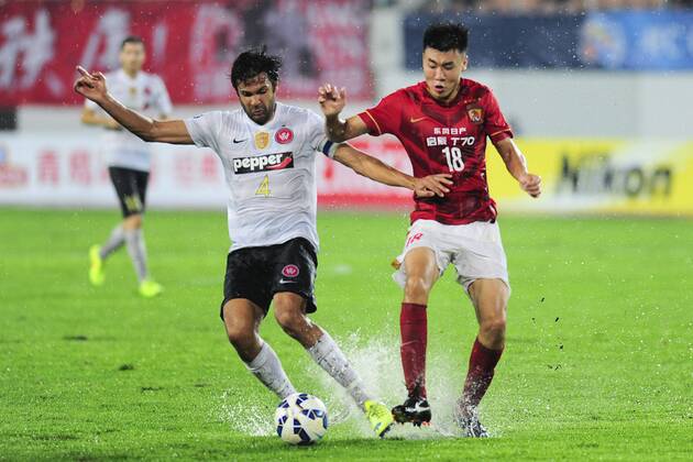 GUANGZHOU, CHINA - MAY 05: (CHINA OUT) Dong Xuesheng 18 of Guangzhou Evergrande and Nikolai Topor-Stanley 4 of Western Sydney Wanderers compete for the ball during the AFC Asian Champions League Group H match between Guangzhou Evergrande and Western Sydney Wanderers at Tianhe Sports Center on May 5, 2015 in Guangzhou, China.  CFP467029044 
