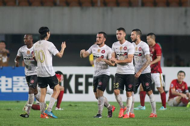 GUANGZHOU, CHINA - MAY 05: (CHINA OUT) Mark Bridge 19 of Western Sydney Wanderers celebrates with team mates after scoring his team s first goal during the AFC Asian Champions League Group H match between Guangzhou Evergrande and Western Sydney Wanderers at Tianhe Sports Center on May 5, 2015 in Guangzhou, China.  CFP467029056 
