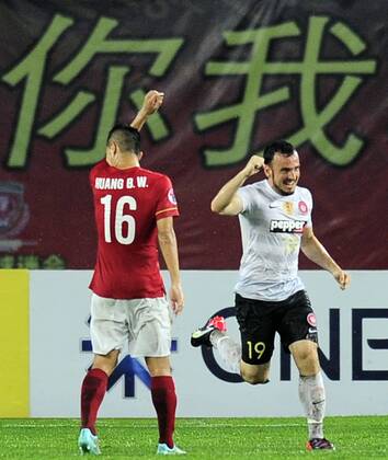 GUANGZHOU, CHINA - MAY 05: (CHINA OUT) Mark Bridge 19 of Western Sydney Wanderers celebrates after scoring his team s first goal during the AFC Asian Champions League Group H match between Guangzhou Evergrande and Western Sydney Wanderers at Tianhe Sports Center on May 5, 2015 in Guangzhou, China.  CFP467029050 
