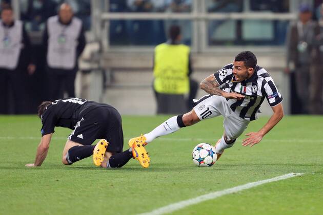 Daniel Carvajal of Real Madrid brings down Juventus Carlos Tevez to concede a penalty - Juventus vs. Real Madrid - UEFA Champion s League - Semi Final First Leg - Juventus Stadium - Turin - 05 05 2015 Pic Philip Oldham Sportimage EDITORIAL USE ONLY. No use with unauthorised audio, video, data, fixture lists, club league logos or live services. Online in-match use limited to 120 images, no video emulation. No use in betting, games or single club league player publications.