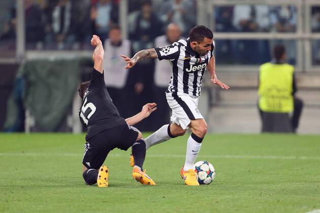 Daniel Carvajal of Real Madrid brings down Juventus Carlos Tevez to concede a penalty - Juventus vs. Real Madrid - UEFA Champion s League - Semi Final First Leg - Juventus Stadium - Turin - 05 05 2015 Pic Philip Oldham Sportimage EDITORIAL USE ONLY. No use with unauthorised audio, video, data, fixture lists, club league logos or live services. Online in-match use limited to 120 images, no video emulation. No use in betting, games or single club league player publications.