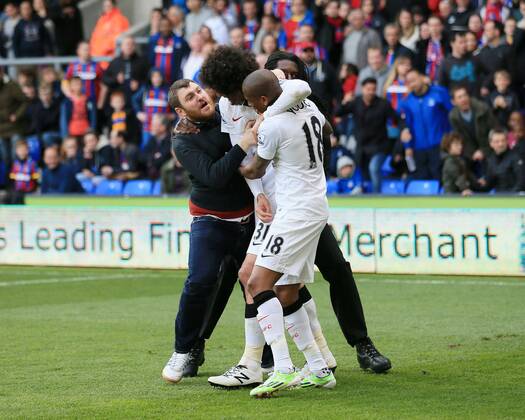 Manchester United ManU s Marouane Fellaini celebrates scoring his sides second goal as fans invade the pitch Barclays Premier League - Crystal Palace vs Manchester United- Selhurst Park - England - 9th May 2015 - Picture David Klein Sportimage EDITORIAL USE ONLY. No use with unauthorised audio, video, data, fixture lists, club league logos or live services. Online in-match use limited to 120 images, no video emulation. No use in betting, games or single club league player publications.