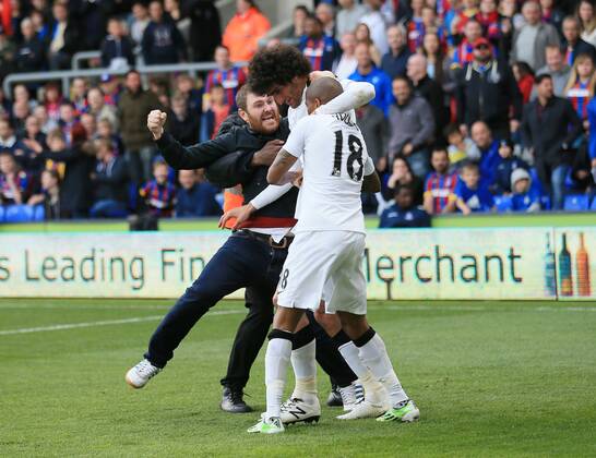 Manchester United ManU s Marouane Fellaini celebrates scoring his sides second goal as fans invade the pitch Barclays Premier League - Crystal Palace vs Manchester United- Selhurst Park - England - 9th May 2015 - Picture David Klein Sportimage EDITORIAL USE ONLY. No use with unauthorised audio, video, data, fixture lists, club league logos or live services. Online in-match use limited to 120 images, no video emulation. No use in betting, games or single club league player publications.