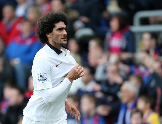 Manchester United ManU s Marouane Fellaini celebrates scoring his sides second goal as fans invade the pitch Barclays Premier League - Crystal Palace vs Manchester United- Selhurst Park - England - 9th May 2015 - Picture David Klein Sportimage EDITORIAL USE ONLY. No use with unauthorised audio, video, data, fixture lists, club league logos or live services. Online in-match use limited to 120 images, no video emulation. No use in betting, games or single club league player publications.