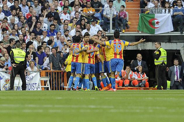 Valencia s players celebrate a goal during 2014-15 La Liga match between Real Madrid and Valencia at Santiago Bernabeu stadium in Madrid, Spain. May 09, 2015. (20150509045)