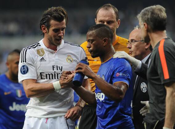 Real Madrid Midfielder, Gareth Frank Bale - BALE, number 11 . Juventus Defender Patrice Evra - VIDAL, number 23. Round semifinal of the CHAMPIONS league Basketball match between Real Madrid - Juventus at the Santiago Bernabeu estadium Madrid - Spain by May 13 2015. 