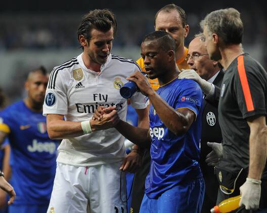 Real Madrid Midfielder, Gareth Frank Bale - BALE, number 11 . Juventus Defender Patrice Evra - VIDAL, number 23. Round semifinal of the CHAMPIONS league Basketball match between Real Madrid - Juventus at the Santiago Bernabeu estadium Madrid - Spain by May 13 2015. 