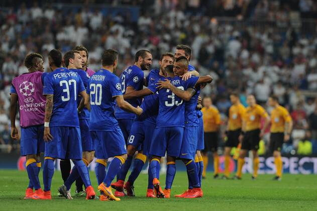 Juventus Goalkeeper, Gianluigi Buffon - Buffon, number 1 celebrates after scoring a goal (1,1). Juventus Midfielder, Romulo Souza Orestes Caldeira - ORESTES, number 2. Juventus Defender, Giorgio Chiellini - CHIELLINI, number 3. Juventus Defender, Martin Caceres - CACERES, number 4. Juventus Defender, Angelo Ogbonna - OGBONNA, number 5. Juventus Midfielder, Paul Pogba - POGBA, number 6. Juventus Midfielder, Simone Pepe - PEPE, number 7. Juventus Midfielder, Claudio Marchisio - MARCHISIO, number 8. Juventus Forward, Alvaro Morata - MORATA, number 9. Juventus Forward, Carlos Tevez - TEVEZ, number 10. Juventus Midfielder, Kingsley Coman - COMAN, number 11. Juventus Forward, Fernando Llorente - Llorente, number 14. Juventus Defender, Adrea Barzagli - BARZAGLI, number 15. Juventus Defender, Paolo De Ceglie - DE CEGLIE, number 17. Juventus Defender, Leonardo Bonucci - BONUCCI, number 19. Juventus Midfielder, Simone Padoin - PADOIN, number 20. Juventus Midfielder, Andrea Pirlo - PIRLO, number 21. Juventus Midfielder, Kwadwo Asamoah - ASAMOAH, number 22. Juventus Midfielder, Arturo Vidal - VIDAL, number 23. Juventus Defender, Stephan Lichtsteiner - Lichtsteiner, number 26. Juventus Midfielder, Stefano Sturaro - STURARO, number 27. Juventus Goalkeeper, Marco Storari - Marco Storari, number 30. Juventus Forward, Alessandro Matri - MATRI, number 32. Juventus Defender, Patrice Evra - EVRA, number 33. Juventus Goalkeeper, Rubens Fernando Moedim - Moedim, number 34. Juventus Midfielder, Roberto Maximiliano Pereyra - PEREYRA, number 37. Juventus Defender, Luca Marrone - MARRONE, number 39. Round semifinal of the CHAMPIONS league Basketball match between Real Madrid - Juventus at the Santiago Bernabeu estadium Madrid - Spain by May 13 2015.
