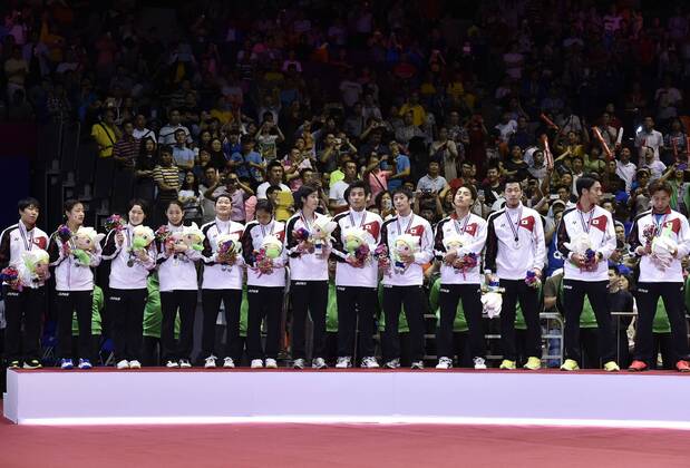(150517) -- DONGGUAN, May 17, 2015 -- Silver medallists, Players of Japan celebrate during the awarding ceremony after the final of 2015 Sudirman Cup BWF World Mixed Team Championships in Dongguan, south China s Guangdong Province, May 17, 2015. ) (SP)CHINA-DONGGUAN-BADMINTON-2015 SUDIRMAN CUP(CN) LiangxXu 