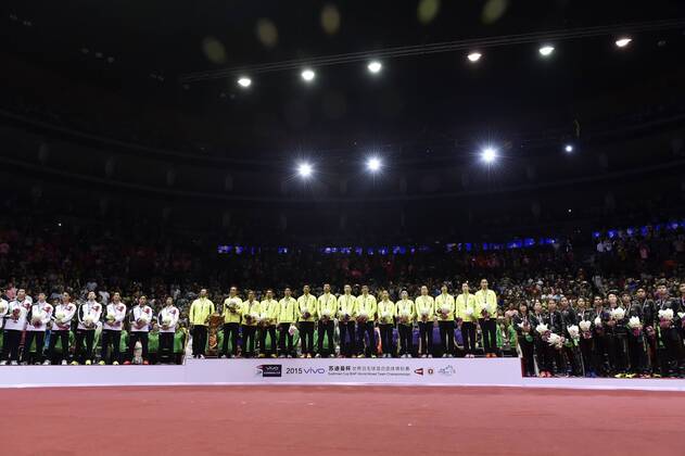 (150517) -- DONGGUAN, May 17, 2015 -- Team of Japan(L),Team of China(C) and Players of South Korea celebrate during the awarding ceremony after the final of 2015 Sudirman Cup BWF World Mixed Team Championships in Dongguan, south China s Guangdong Province, May 17, 2015. ) (SP)CHINA-DONGGUAN-BADMINTON-2015 SUDIRMAN CUP(CN) LiangxXu 