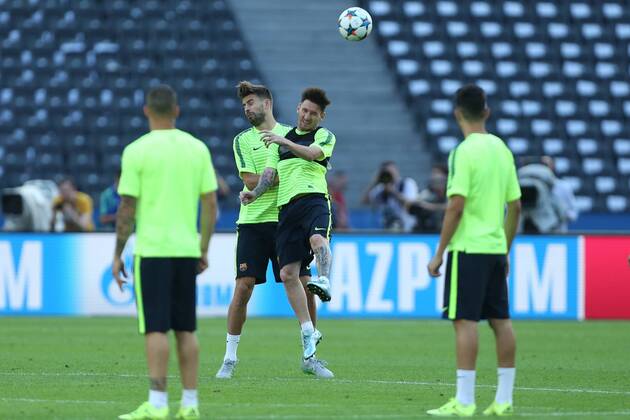 Lionel Messi contest a header with Gerard Pique of Barcelona - Training - Juventus vs. Barcelona - Champion s League Final - Olympic Stadium - Berlin - Germany - 05 06 2015 Pic Philip Oldham Sportimage EDITORIAL USE ONLY. No use with unauthorised audio, video, data, fixture lists, club league logos or live services. Online in-match use limited to 120 images, no video emulation. No use in betting, games or single club league player publications.