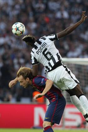 SOCCER - CL, Barcelona vs Juventus BERLIN,GERMANY,06.JUN.15 - SOCCER - UEFA Champions League Final, FC Barcelona Barca vs Juventus Turin. Image shows Paul Pogba (Turin) and Ivan Rakitic (Barcelona). GEPAxpictures xMathiasxMandl
