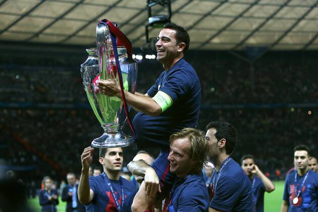 Xavi Hernandez of Barcelona celebrates with the trophy - Juventus vs. Barcelona - Champion s League Final - Olympic Stadium - Berlin - Germany - 06 06 2015 Pic Philip Oldham Sportimage EDITORIAL USE ONLY. No use with unauthorised audio, video, data, fixture lists, club league logos or live services. Online in-match use limited to 120 images, no video emulation. No use in betting, games or single club league player publications.