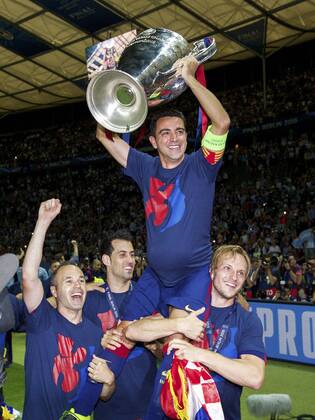 (L-R) Andres Iniesta of FC Barcelona Barca Sergio Busquets of FC Barcelona, Xavi Hernandez of FC Barcelona, Ivan Rakitic of FC Barcelona with Champions League trophy during the UEFA Champions League final match between Barcelona and Juventus on June 6, 2015 at the Olympic stadium in Berlin, Germany. Barcelona v Juventus Champions League final 2014 2015 xVIxxIVx 3946789