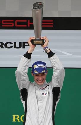MOTORSPORTS - Porsche Super Cup 2015 SPIELBERG,AUSTRIA,21.JUN.15 - MOTORSPORTS - Porsche Supercup, Red Bull Ring, award ceremony. Image shows the rejoicing of Christopher Zoechling (GER). Keywords: trophy. GEPAxpictures xChristianxWalgram